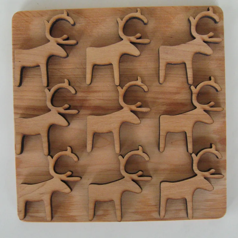 alder trivet with reindeer design 6.5" x 6'5" Made in Sweden