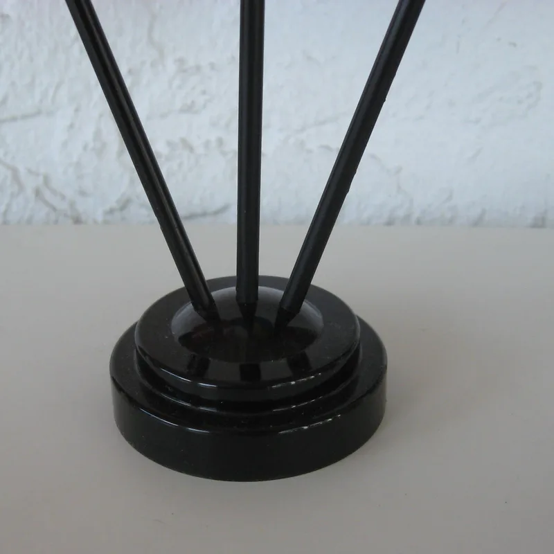 A 3-hole plastic holder for table flags