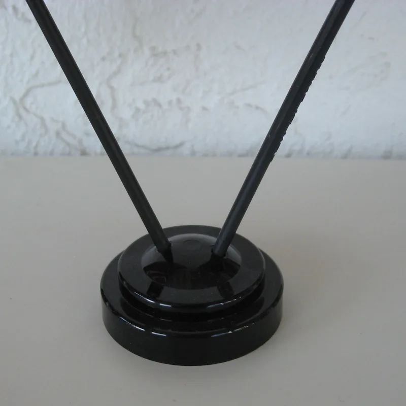 A 2-hole plastic holder for table flags