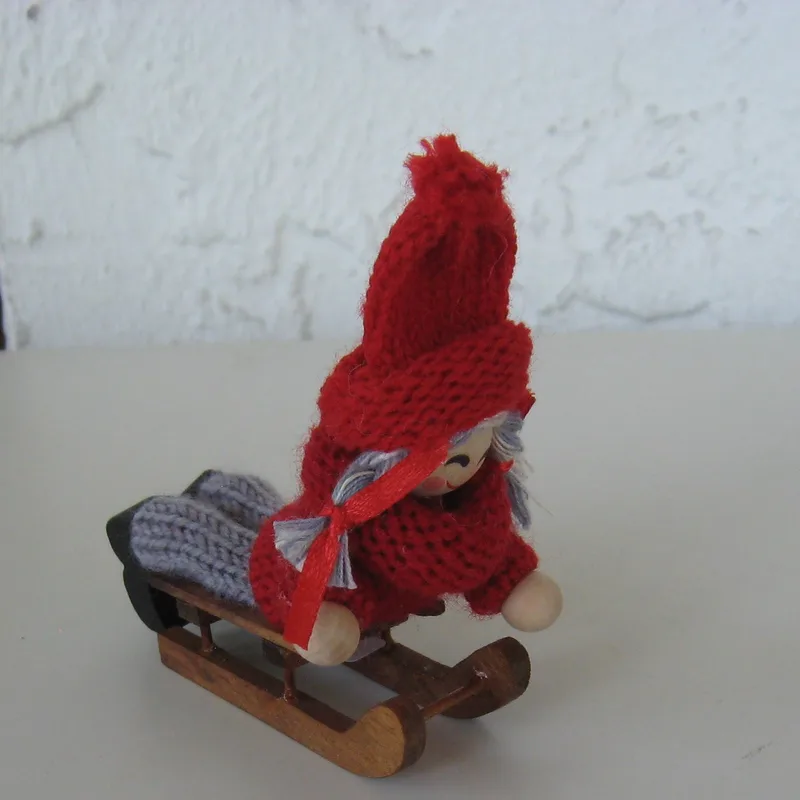 Tomte girl on sled  3" x3"  Made in Sweden